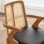 Chaise moderne rembourrée en similicuir à dossier en rotin-745583681