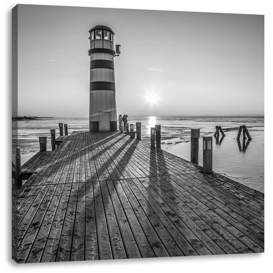 Leinwandbild Leuchtturm am Steg im Sonnenuntergang