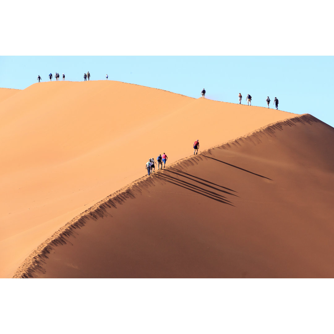 Leinwandbild People Climbing a Dune in Sossusvlei Namibia von Jef Wodniack