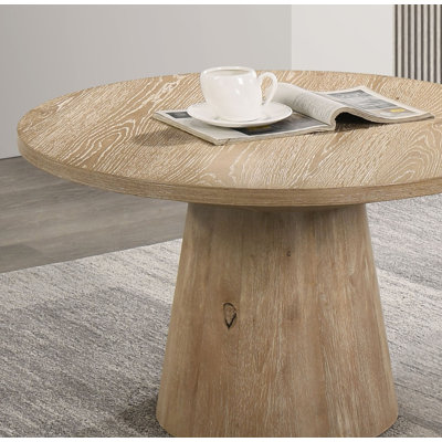 Table basse ronde de style contemporain avec base piédestal en forme de cône