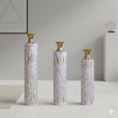 A Set Of Three Meticulously Crafted Metal Floor Vases In Gold And White With Raised Embossed Details. Heights Are 24.61, 28.54, And 32.48 Inches. Suits Modern Vintage Aesthetics In Living Rooms Or Entryways, Excellent For Pampas Grass And As Holiday Or H