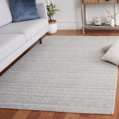 Tapis bleu / gris touffeté à la main