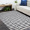 Louella Striped Handwoven Area Rug in Black/Gray