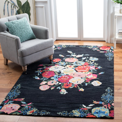 Delmarco Hand Tufted Wool/Cotton Floral Rug in Red/Black/Blue