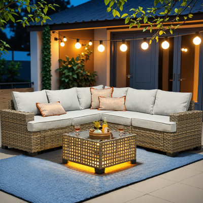 Canapé modulaire en osier pour 5 personnes avec coussins et table en verre Tommy