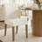 Danayla 4 - Person Dining Table Sets With 41.5'' Round Table & 4 Upholstered Linen Chairs-103707430