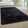 Medinger Solid Color Machine Made Shag Polyester Area Rug in Black