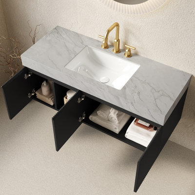 Meuble-lavabo suspendu EIDEN 122 cm (48 po), avec lavabo en céramique et comptoir en pierre frittée veinée gris Carrara. Trois trous prépercés pour la robinetterie. Livré démonté, sans robinet ni bonde. Couleur : noir.