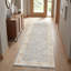 Tapis d'intérieur Vladilen bleu/ivoire à bordure transitionnelle performante-1291889689