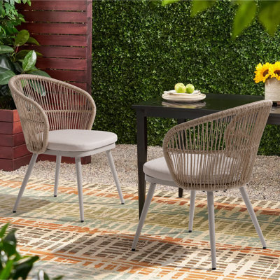 Chaises de salle à manger d'extérieur en osier avec coussins