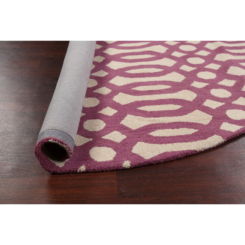 Tapis rond beige / rose en laine touffeté à la main