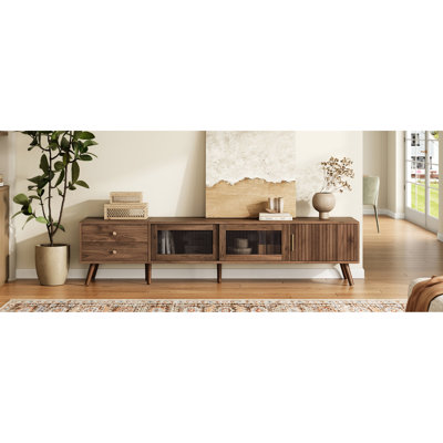 Meuble télé 85 po, design minimaliste moderne 76 po avec portes en verre Waveform, console média grain de bois dans le salon, tiroirs et charnières à fermeture douce