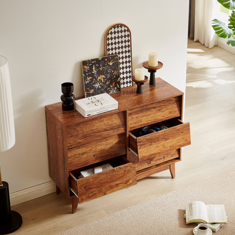 La commode double 6 tiroirs présente un design rétro et biseauté