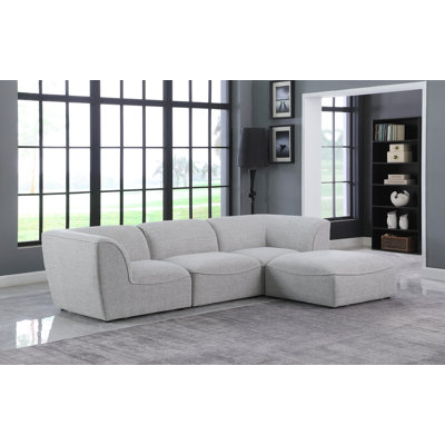 Camani Upholstered L-Shaped Sectional with Ottoman Reversible