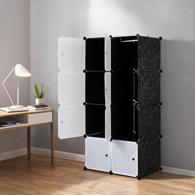 Armoire de rangement blanche et noire de 70 x 45 x 144 cm (27,6 x 17,7 x 56,7 po) avec finitions noires classiques.