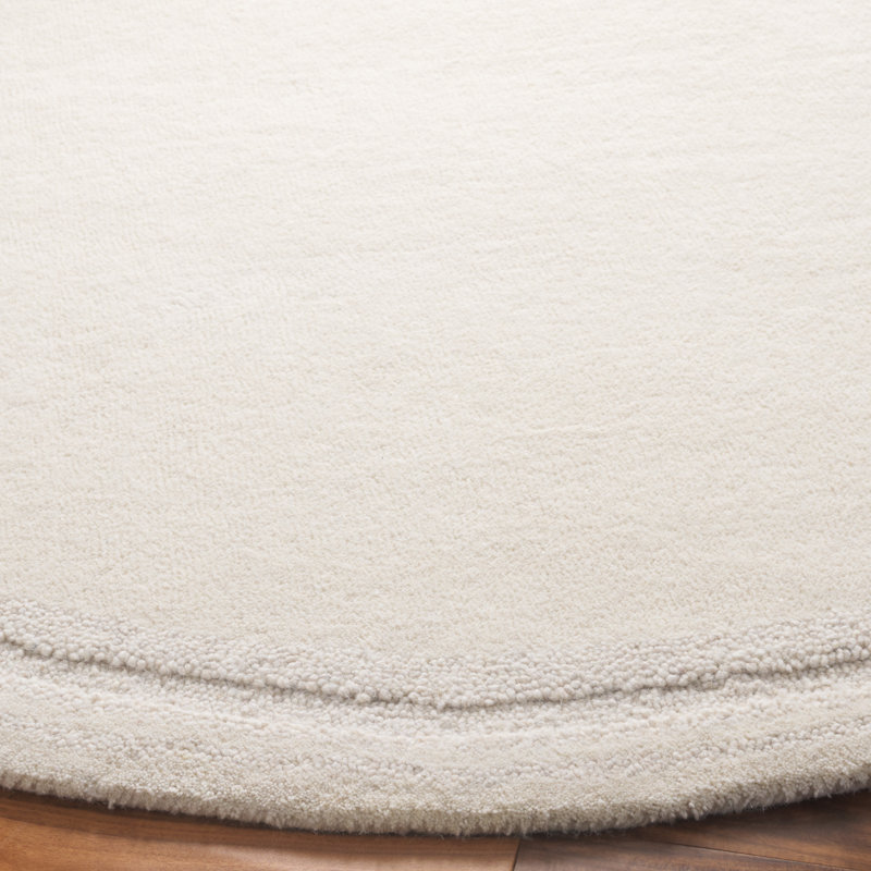 Sopheia Hand Tufted Wool Cotton Solid Color Rug in Ivory, Round 6'