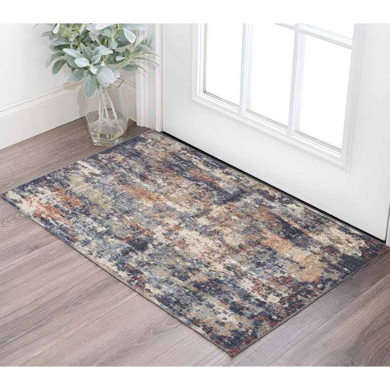 2' X 3' Ivory And Orange Abstract Area Rug