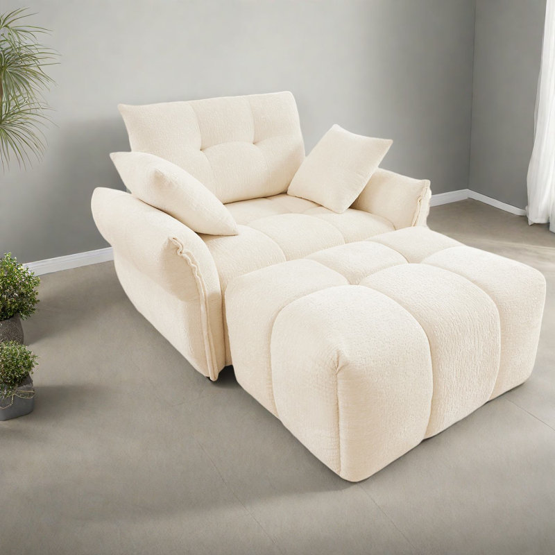 Canapé ergonomique en chenille blanche avec repose-pieds, design moderne pour des espaces de vie polyvalents