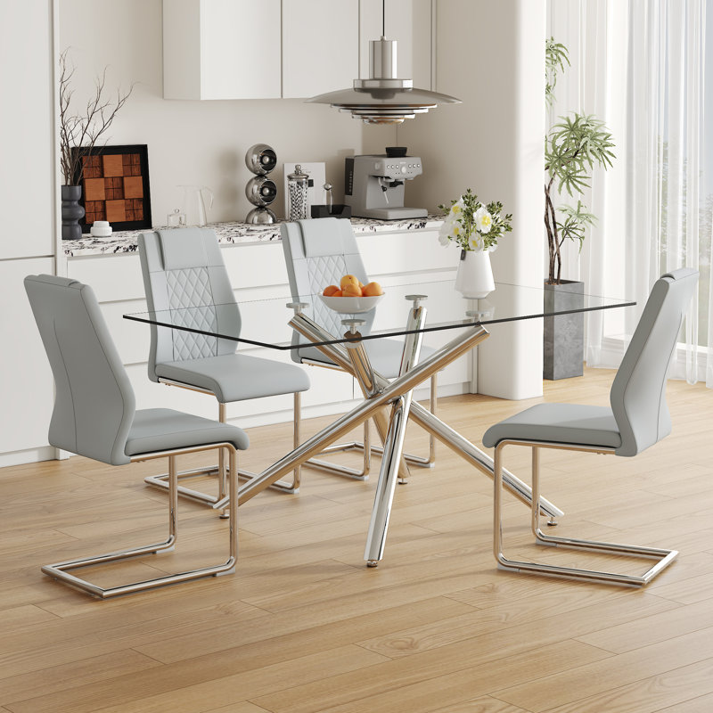 Ensemble de table de salle à manger moderne en verre trempé avec pieds en métal argentés pour des réunions élégantes