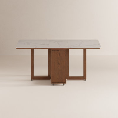 Table de salle à manger pliante en bois massif avec abattants et plateau en pierre frittée, roulettes verrouillables et pieds réglables, design compact et pliable.