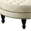 Gruau invitant avec capitonnage moderne et pattes brun foncé