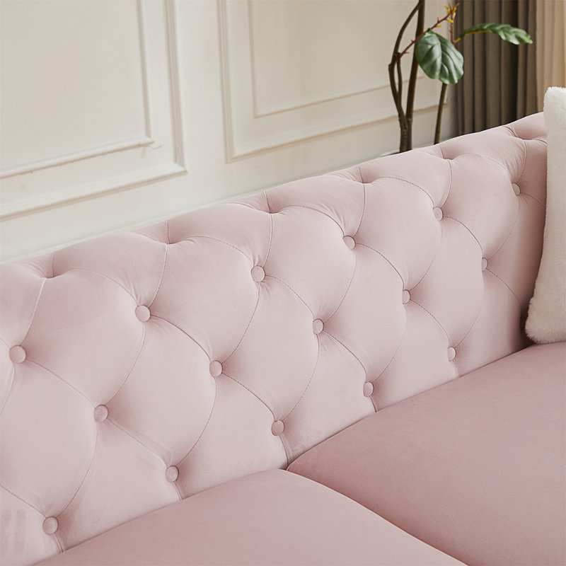 Canapé en velours de style Chesterfield avec détails capitonnés et pieds en métal