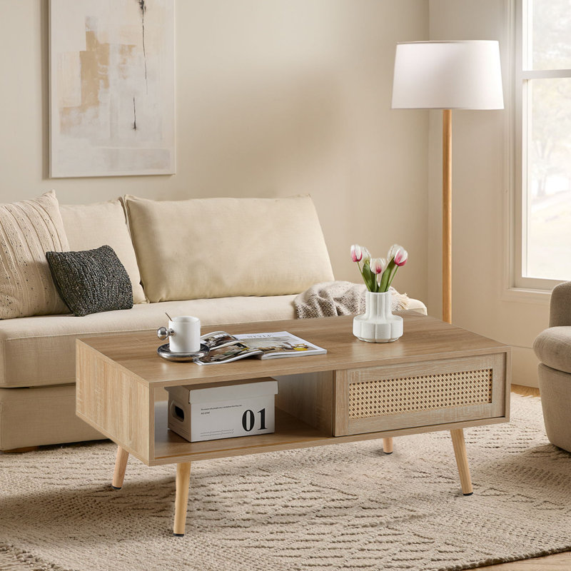Table basse de 41,34 po de style rotin moderne avec pieds de rangement en bois massif et porte coulissante de couleur naturelle