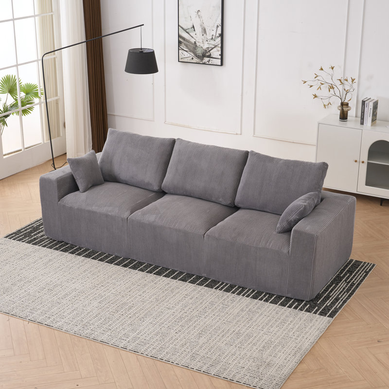 Canapé en forme de L moderne et confortable en velours côtelé pour des espaces polyvalents