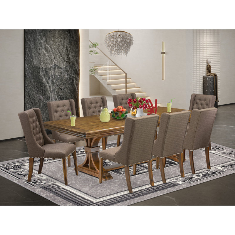 Cet ensemble de salle à manger 5 pièces comprend une table en bois et 4 chaises de cuisine en tissu de lin brun avec dossier capitonné - finition noyer antique.