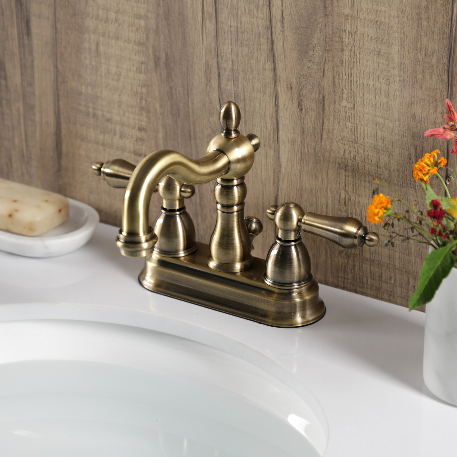 Kingston Brass Heritage Two-Handle 3-Hole Deck Mount 4" Centerset Bathroom Faucet with Plastic Pop-Up, Vintage Brass