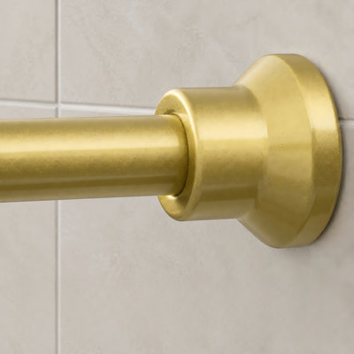 A gold heavy-duty spring-tension shower rod with a 1" diameter and splicing construction, adjustable from 31-102 inch; the no-drill bathroom design is rustproof and non-slip.