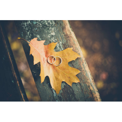 Two Wedding Rings On The Autumn Yellow Leaf Close-up - Wrapped Canvas Print