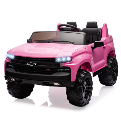 Camion 2 places sous licence pour enfants Silverado de 24 V pour véhicule électrique avec télécommande pour parent, suspension à ressort 4x, 3 vitesses de conduite, musique sans fil, lecteur MP3 - pour les enfants de 3 à 8 ans