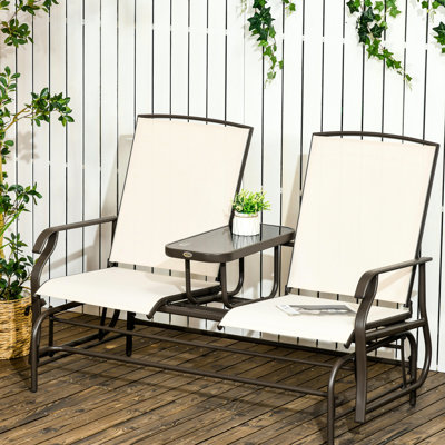 Banc à bascule de patio en métal avec table basse centrale - Beige pour jardins, vérandas, cours arrière. Double bascule pour un confort optimal. Sièges en tissu respirant. Structure en acier robuste.