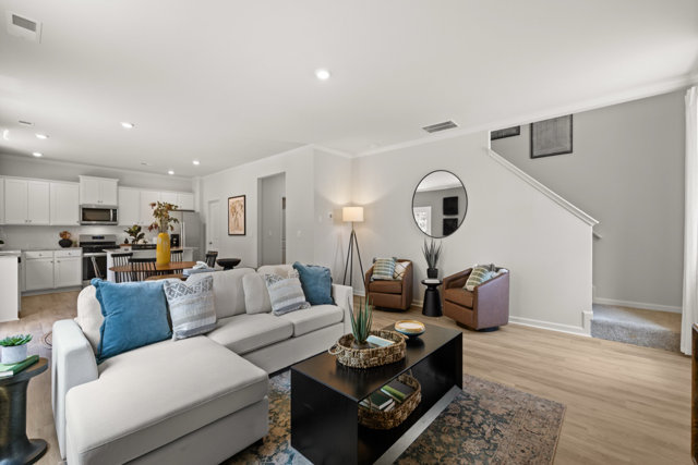 Interior view of living room and kitchen.