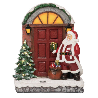 Décoration de Noël illuminant la scène du Père Noël