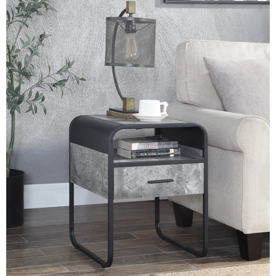 Table de bout moderne au design épuré avec tiroir et tablette, structure en métal noir, finition gris béton pour les salons luxueux