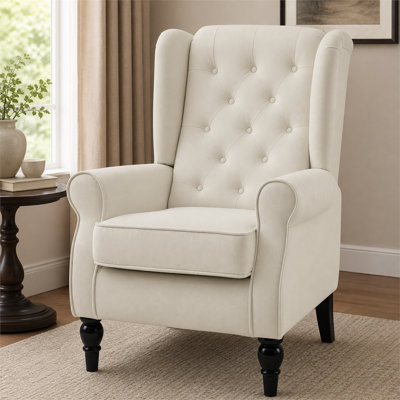 Fauteuil d'appoint capitonné blanc crème avec haut dossier à oreilles, accoudoirs rembourrés arrondis et siège rembourré épais pour la chambre à coucher du salon